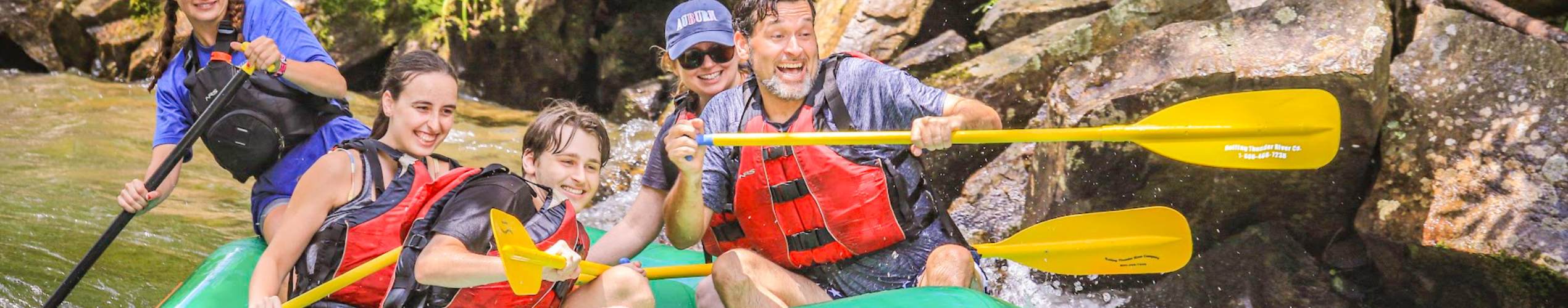 Dad and three kids on a Nantahala rafting trip